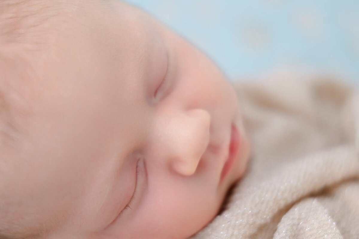 Close-up of baby lips, nose and eyes.