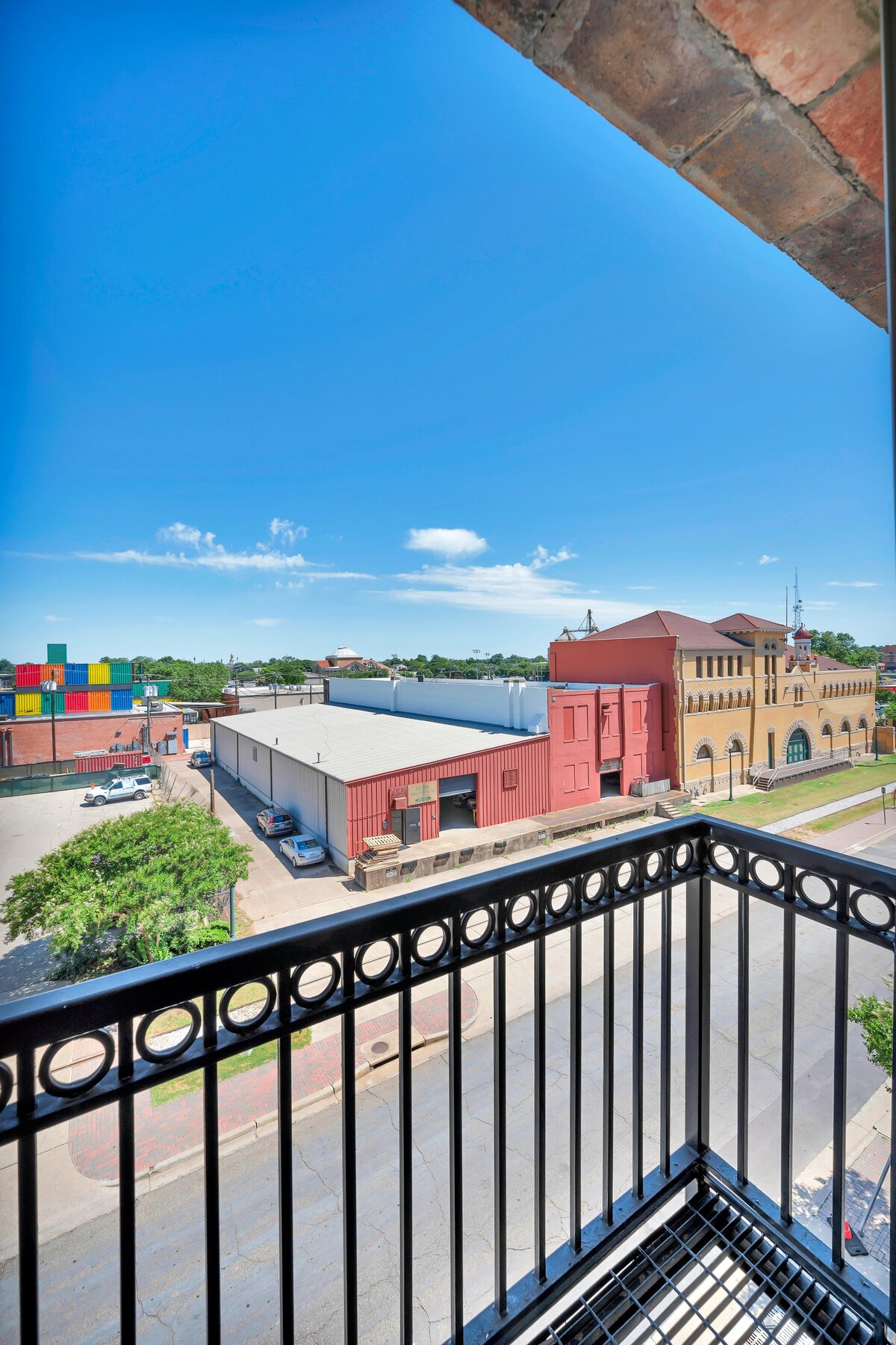 Third floor view from the balcony of this one-bedroom, one-bathroom vintage condo that sleeps 4 in the historic Behrens building in the heart of the Magnolia Silo District in downtown Waco, TX.