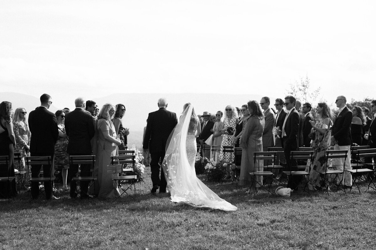 A bride walks down the aisle