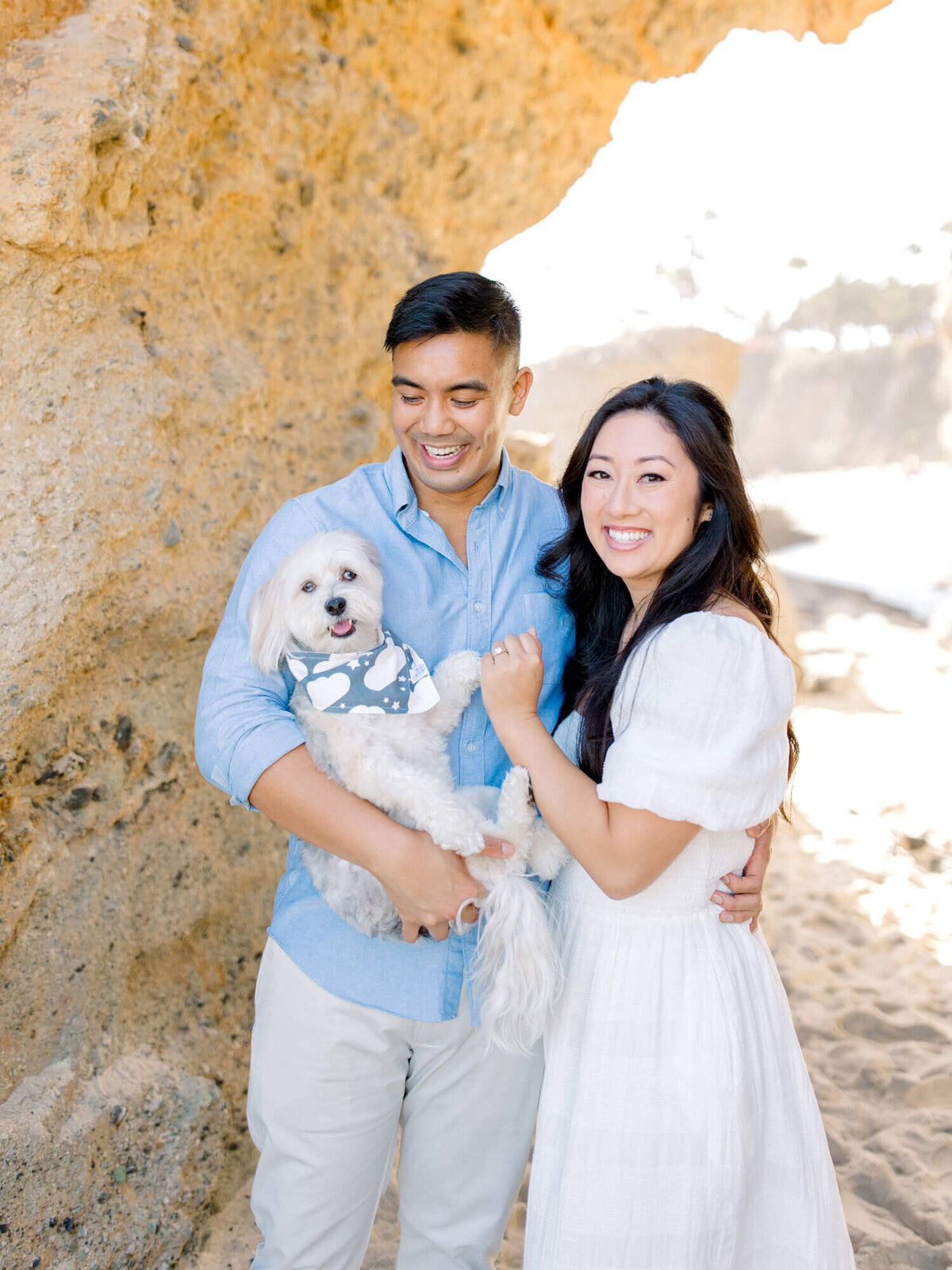 laguna beach couple engagement photo with dog