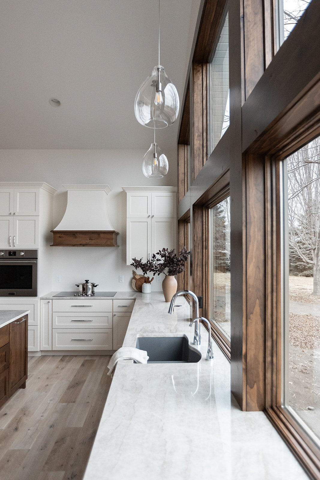 michele rosenboom design clean country renovation kitchen counter and handing pendants over sink