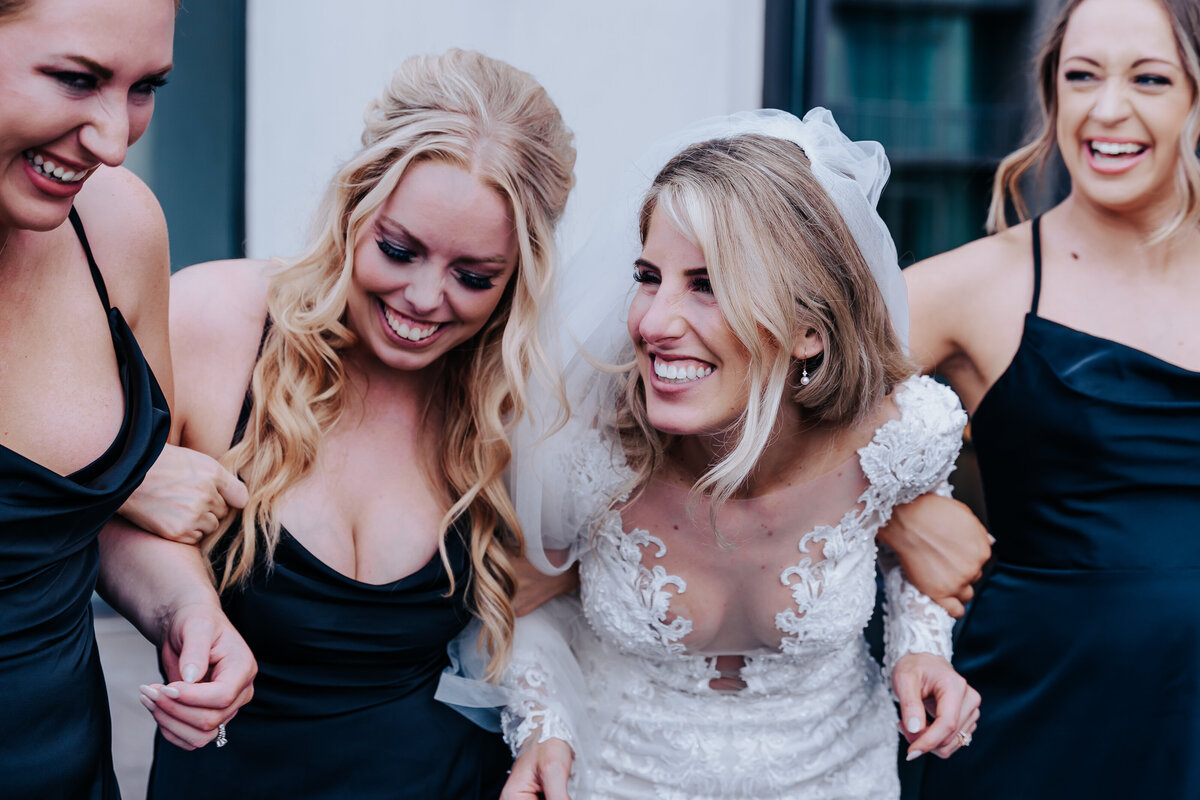 Nashville wedding photographer captures bride laughing with bridesmaids