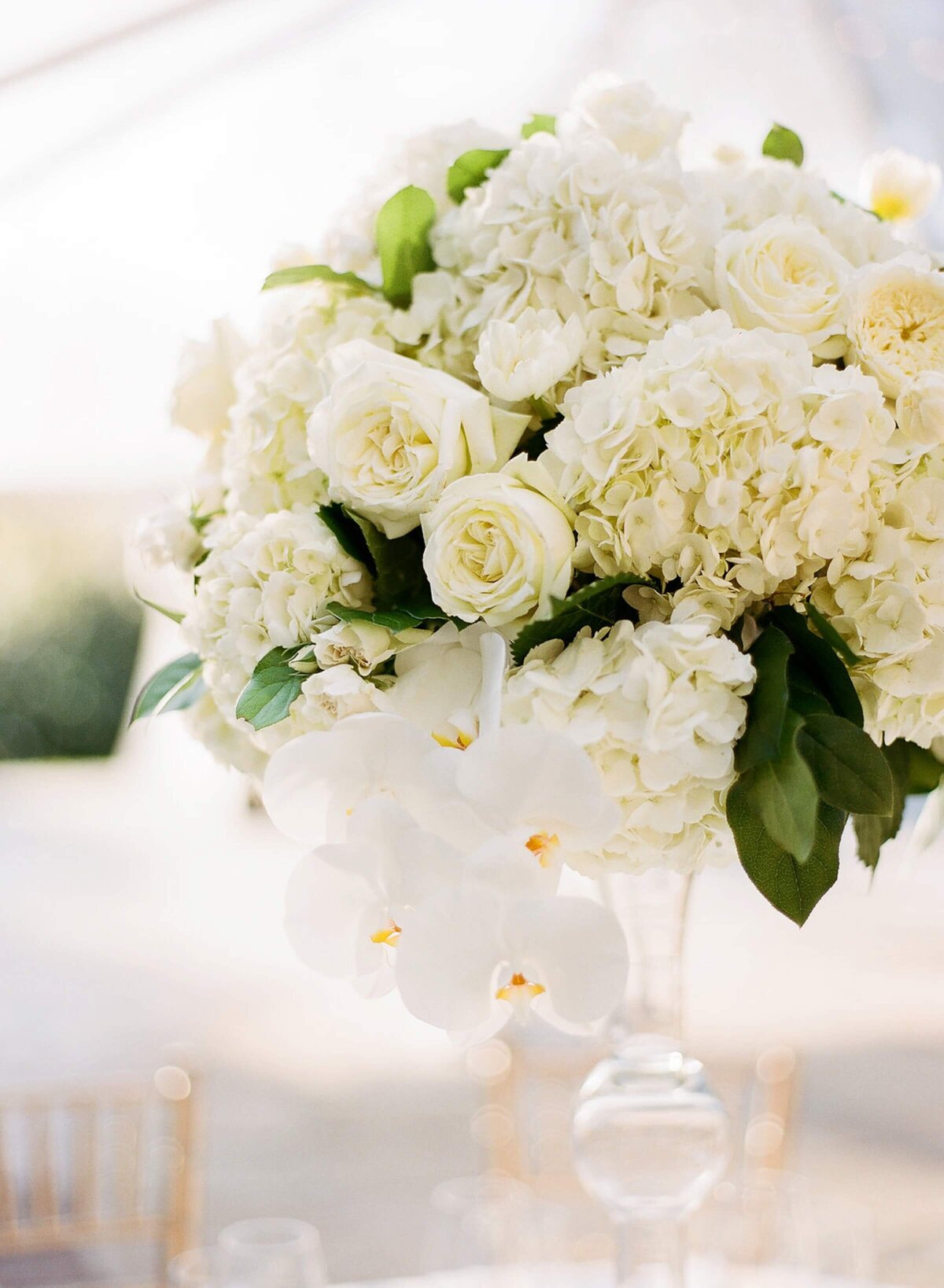 lush white wedding reception floral decor