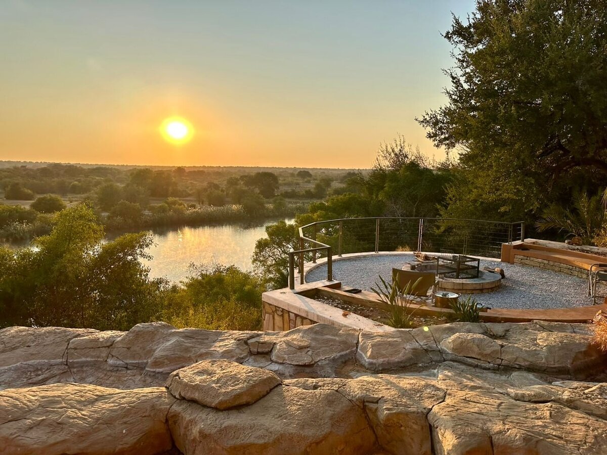 Braai area overlooking sunset over the Okavango River
