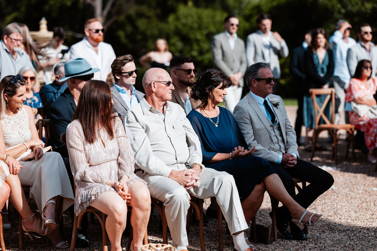 Wedding guests looking into the beautiful Bride!