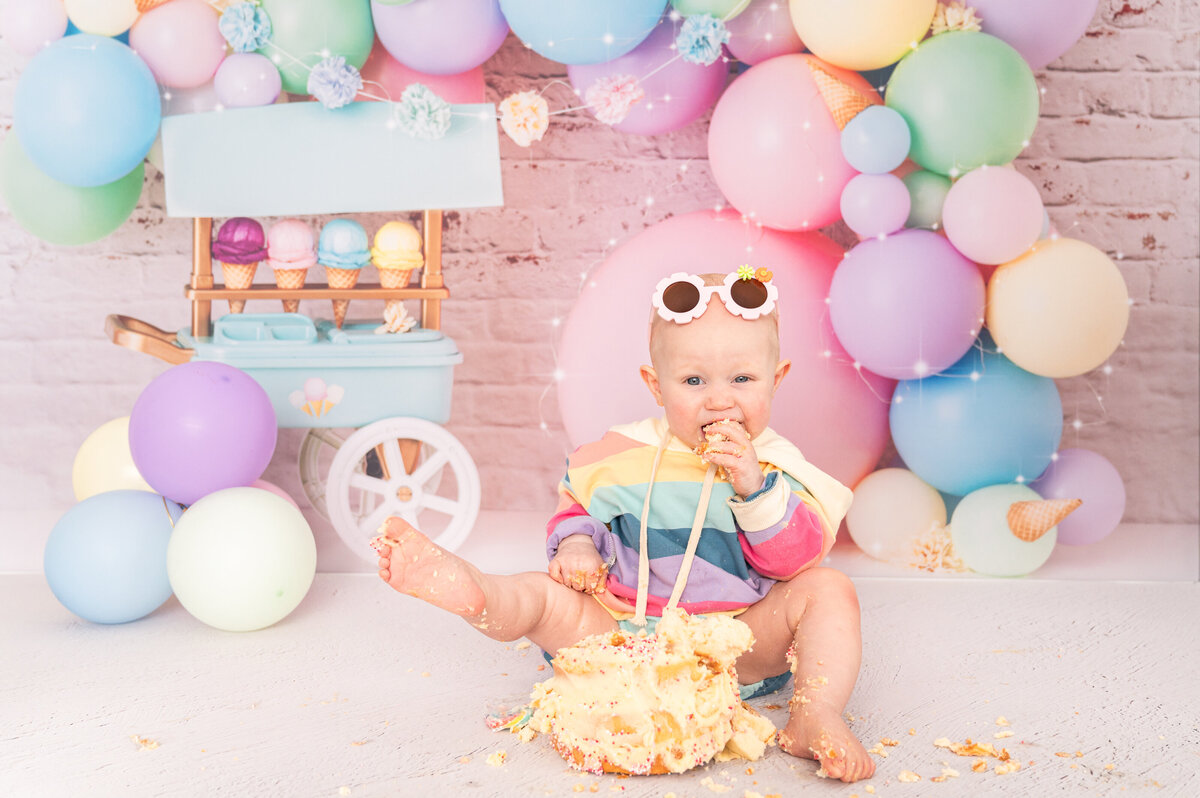 girl with glassed eating cake