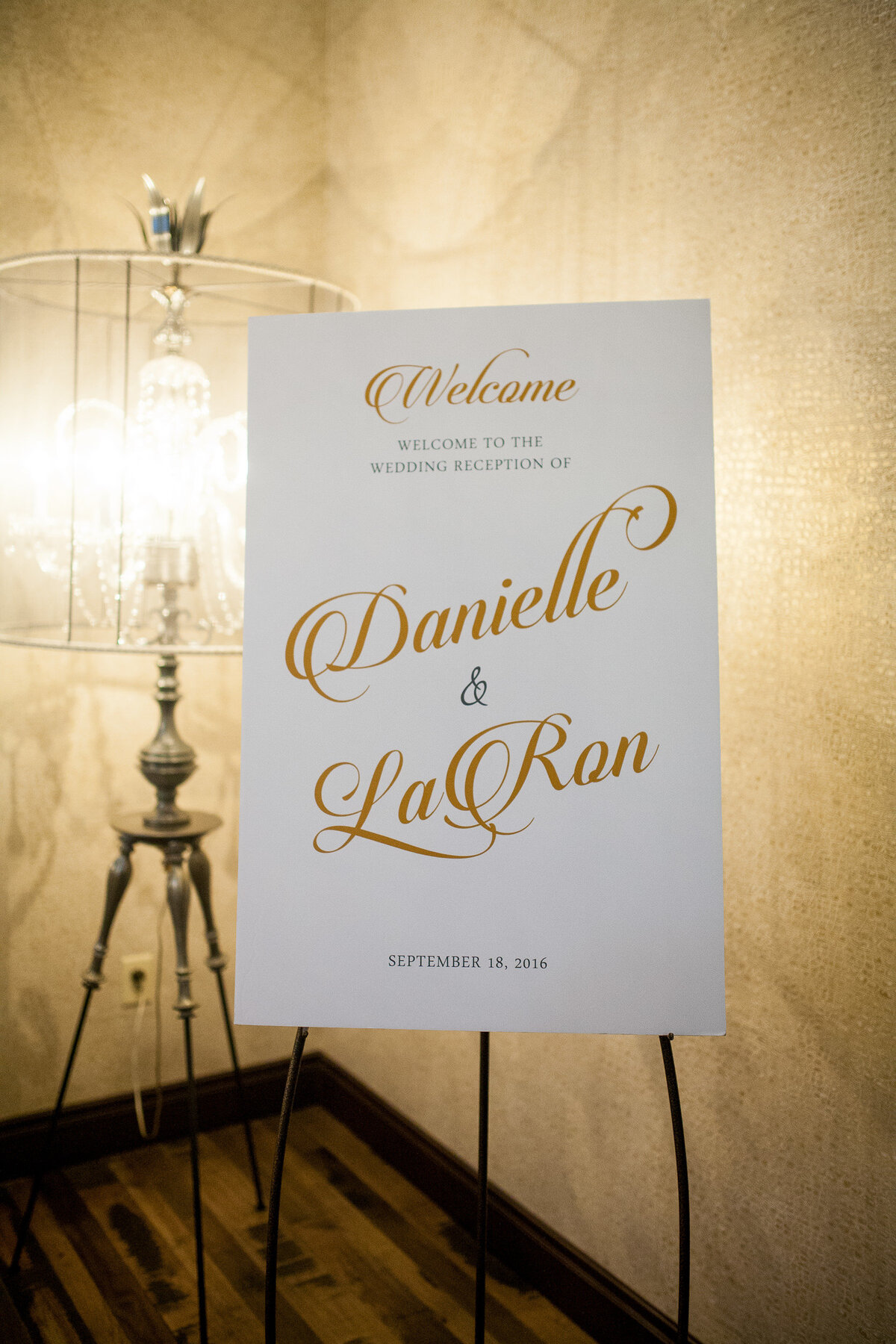 Sign with the Couple’s Names outside the reception hall at the Caramel Room.