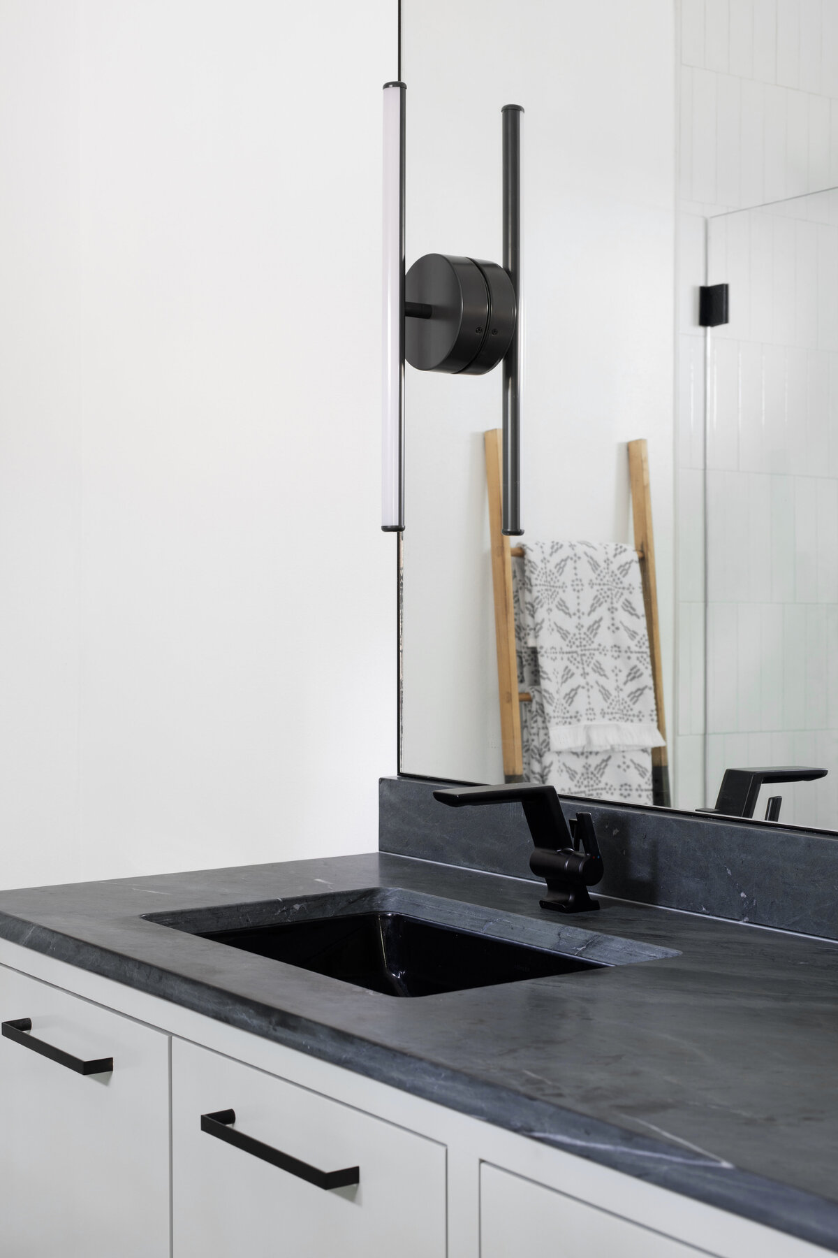 hello-home-sleek-modern-bathroom-design-black-countertops-glass-shower-austin-7