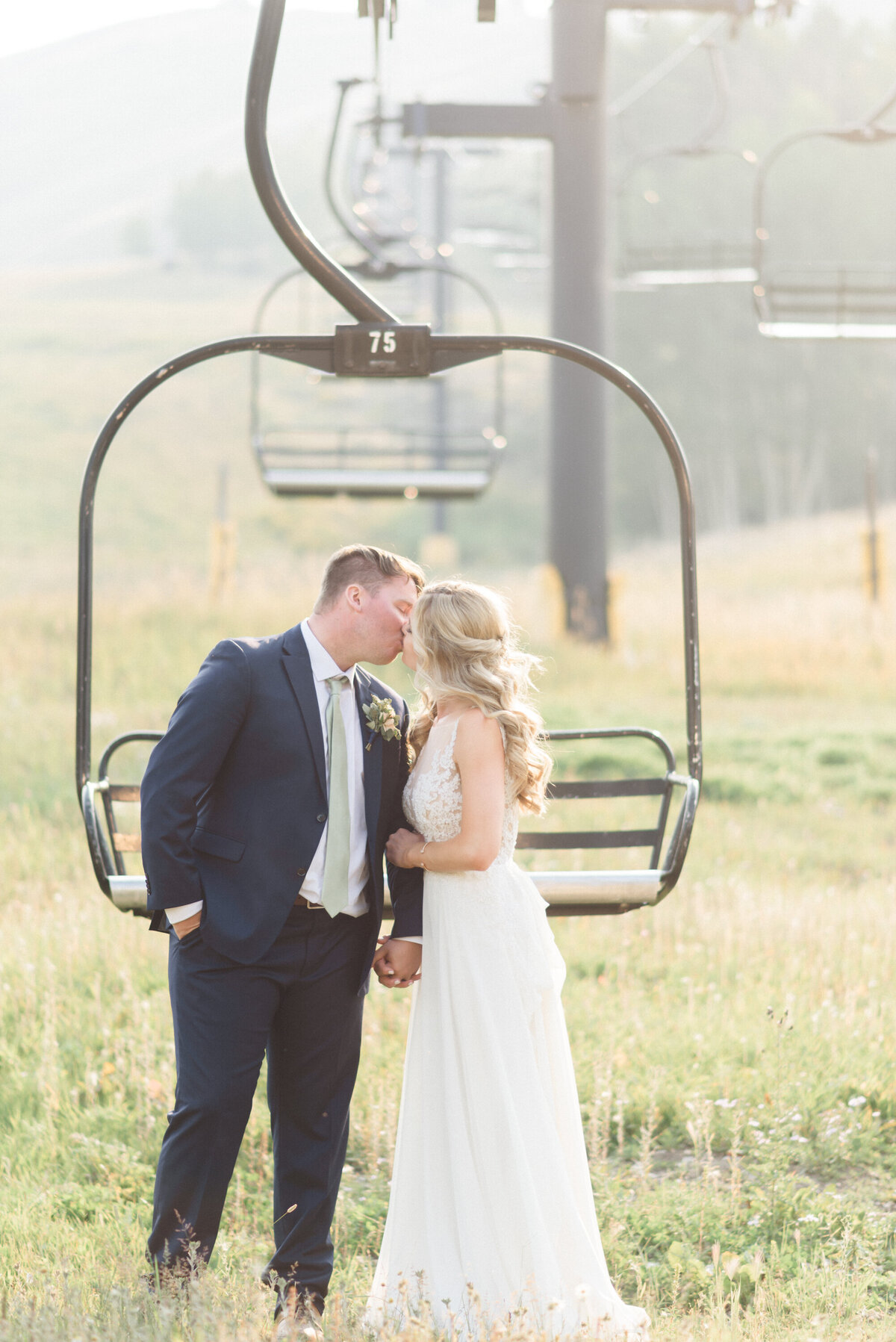 Summer Granby Wedding, bride & groom portraits on chairlift