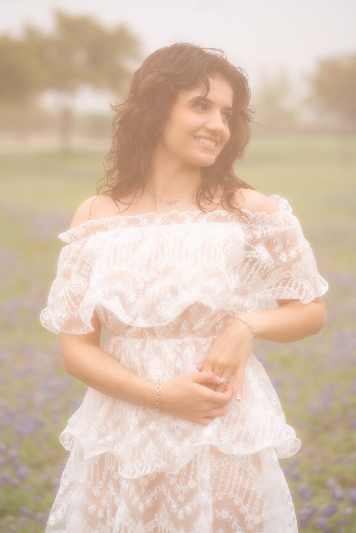 Film style Photo of High school senior girl wearing a white dress in Austin Texas.