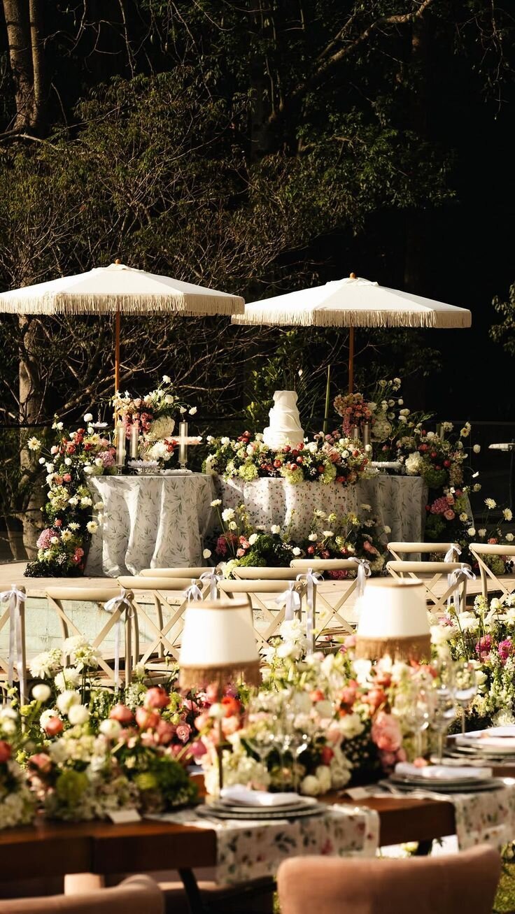 Garden cocktail lounge with umbrellas and pastel florals, outdoor wedding styling inspiration for Airlie Gardens