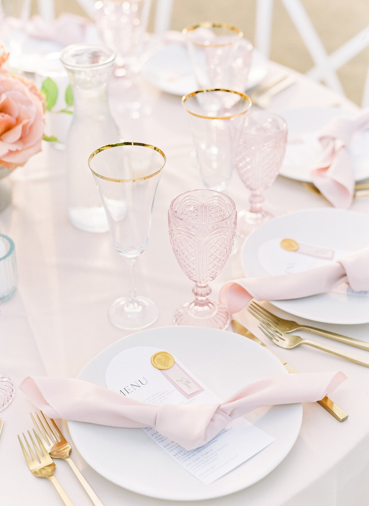 pink accented tablesettings at wedding reception