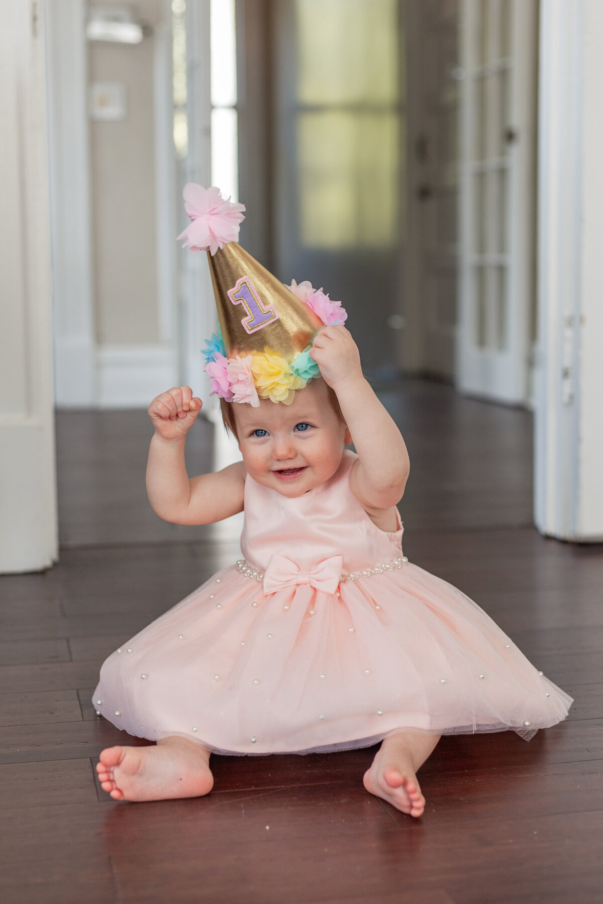 baby girl with 1st birthday hat