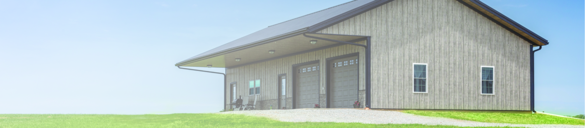 PermaGuard Metal Siding on a home installed in weathered wood.