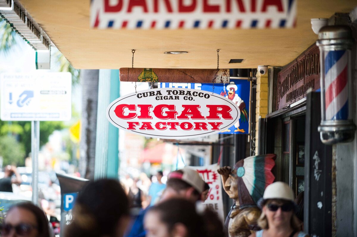 Crowded sidewalk outside cigar factory in Little Havana in Miami FL