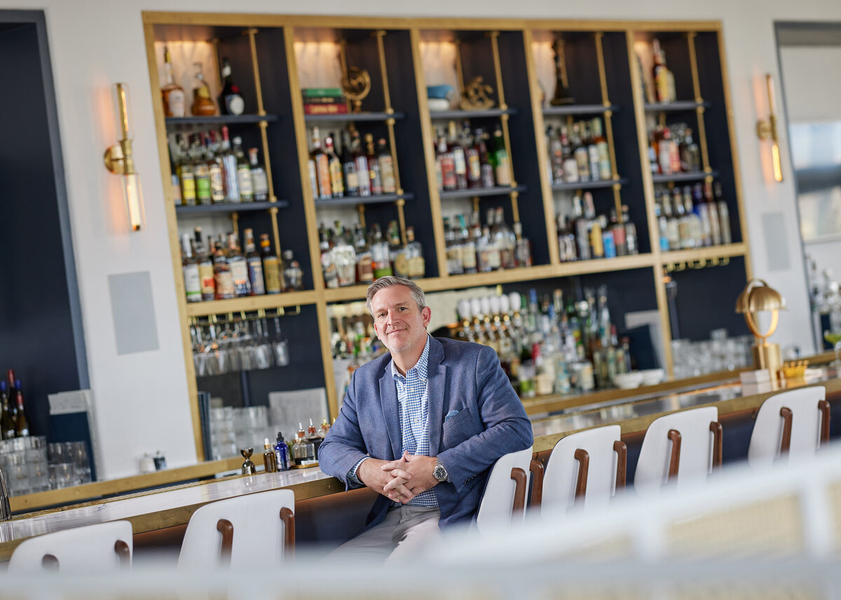 A man sitting at a bar