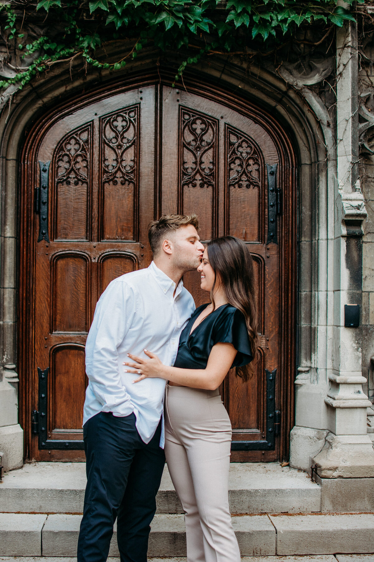engaged couple sharing the love ion the campus of Chicago University, IL