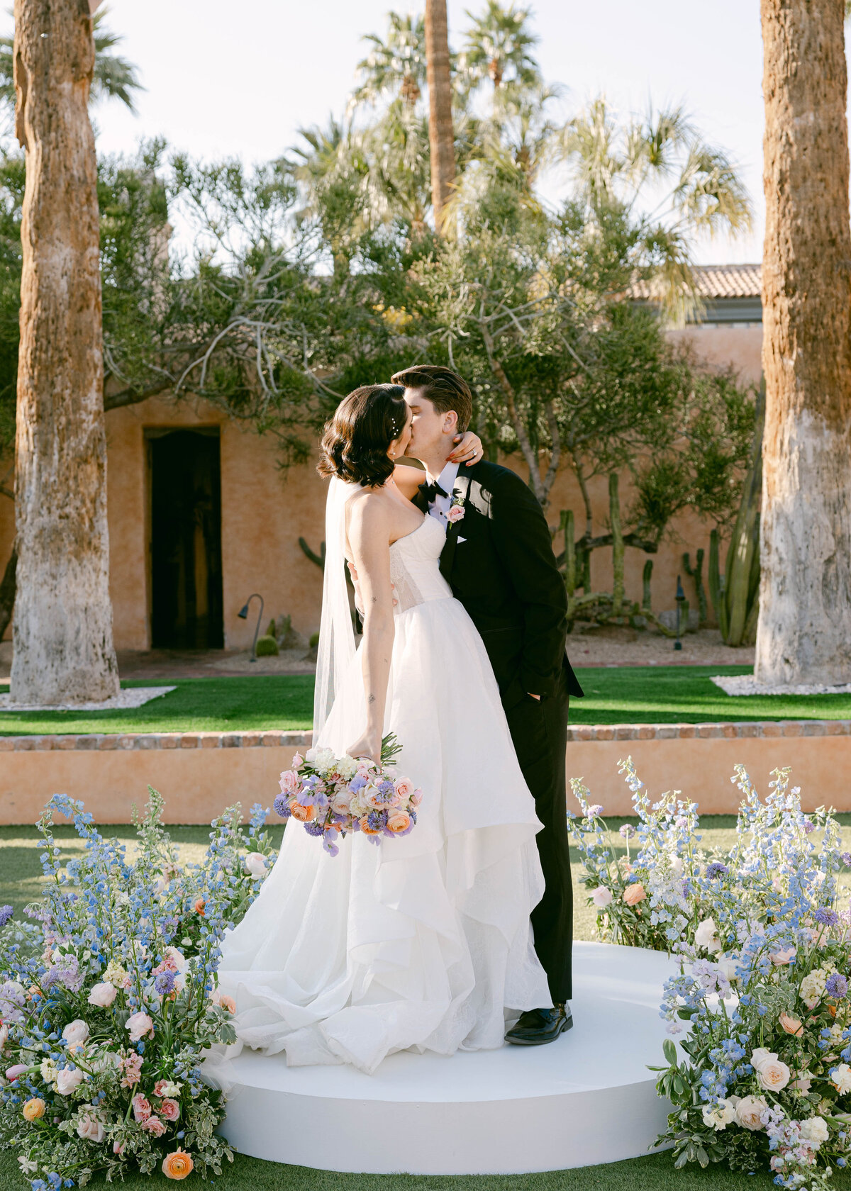 Close-up of fine details, such as wedding rings and floral arrangements, at a luxurious Royal Palms Resort wedding in Scottsdale, Arizona.