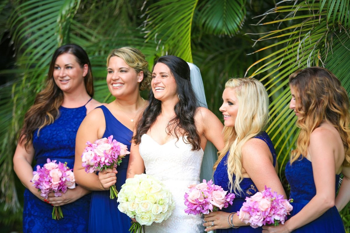 Capture Aloha Photography at The Westin Maui Resort and Spa with bride and bridesmaid with bouquet
