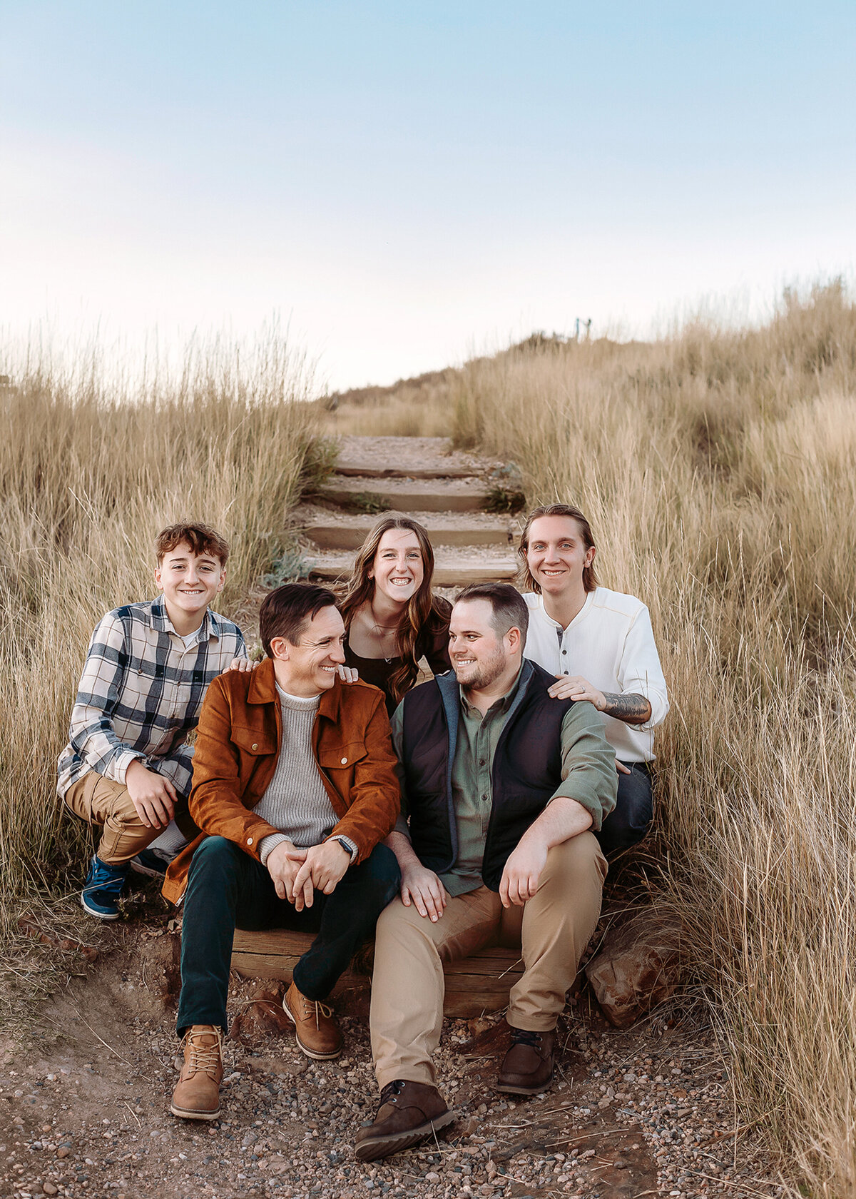 family cuddled up during ther photos at horsetooth  in fort collins