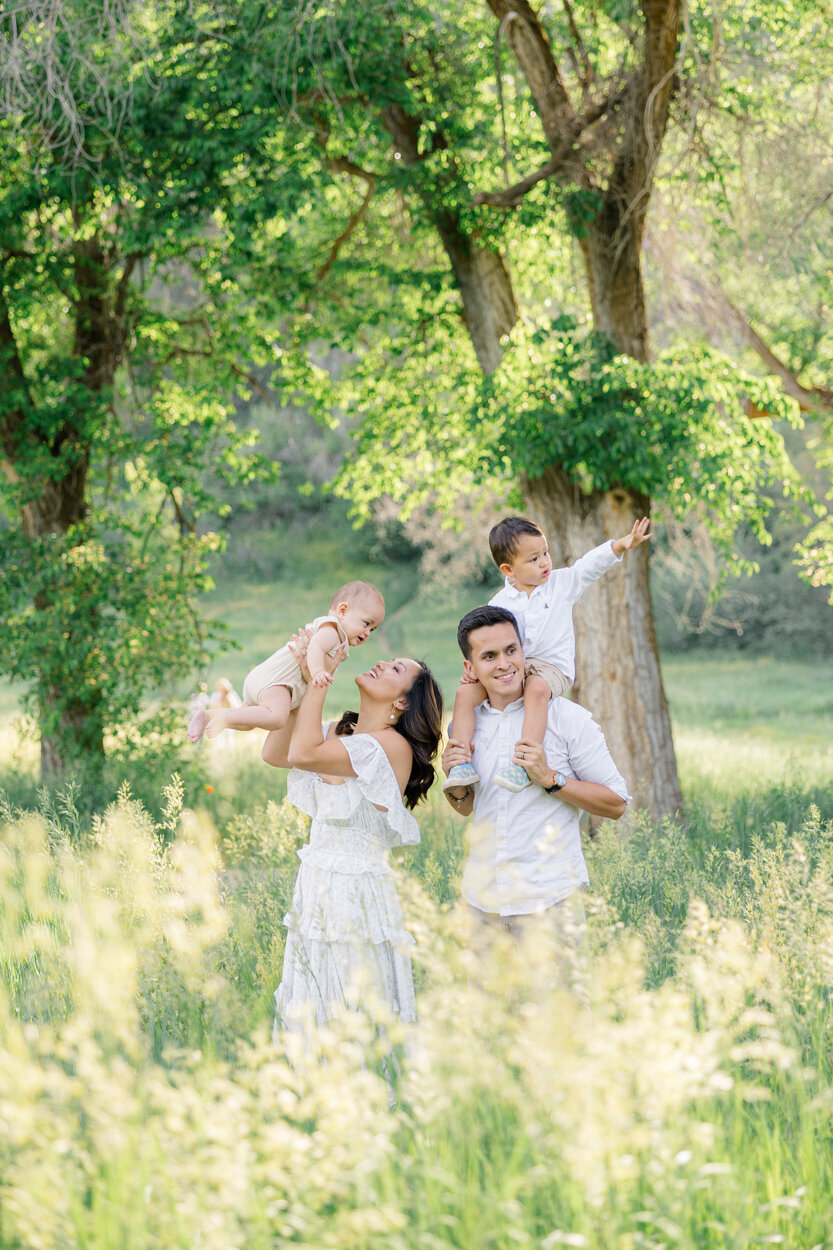 family playing in a field