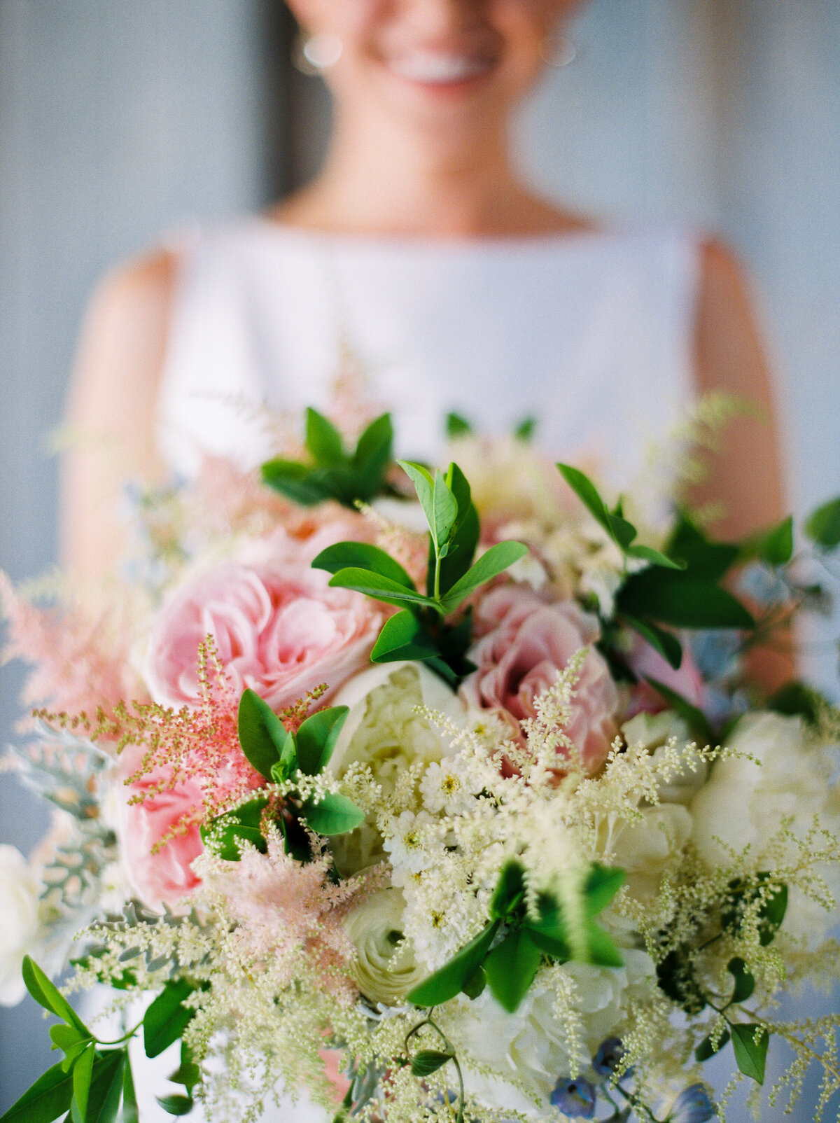 Close-up of a bride's pink, white and green bouquet