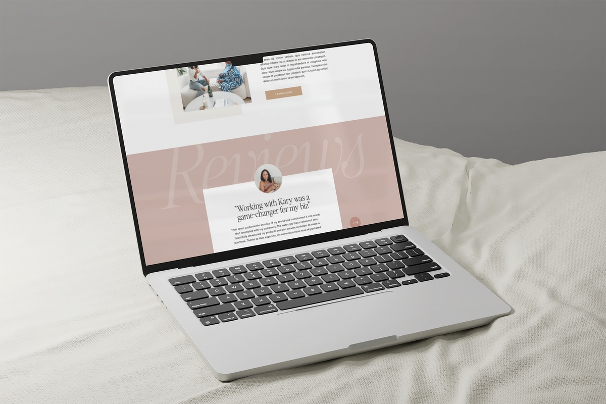 Laptop displaying a website, resting on a cream blanket