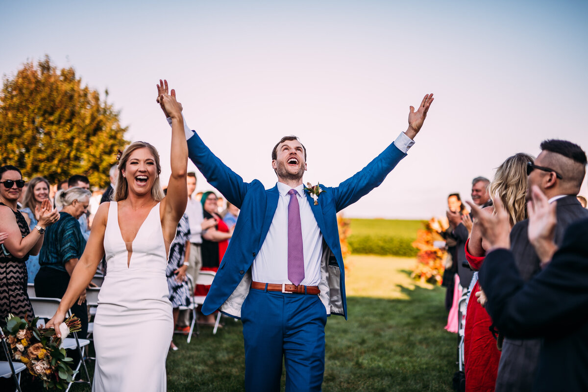 bride and groom processional at their farm wedding in missouri