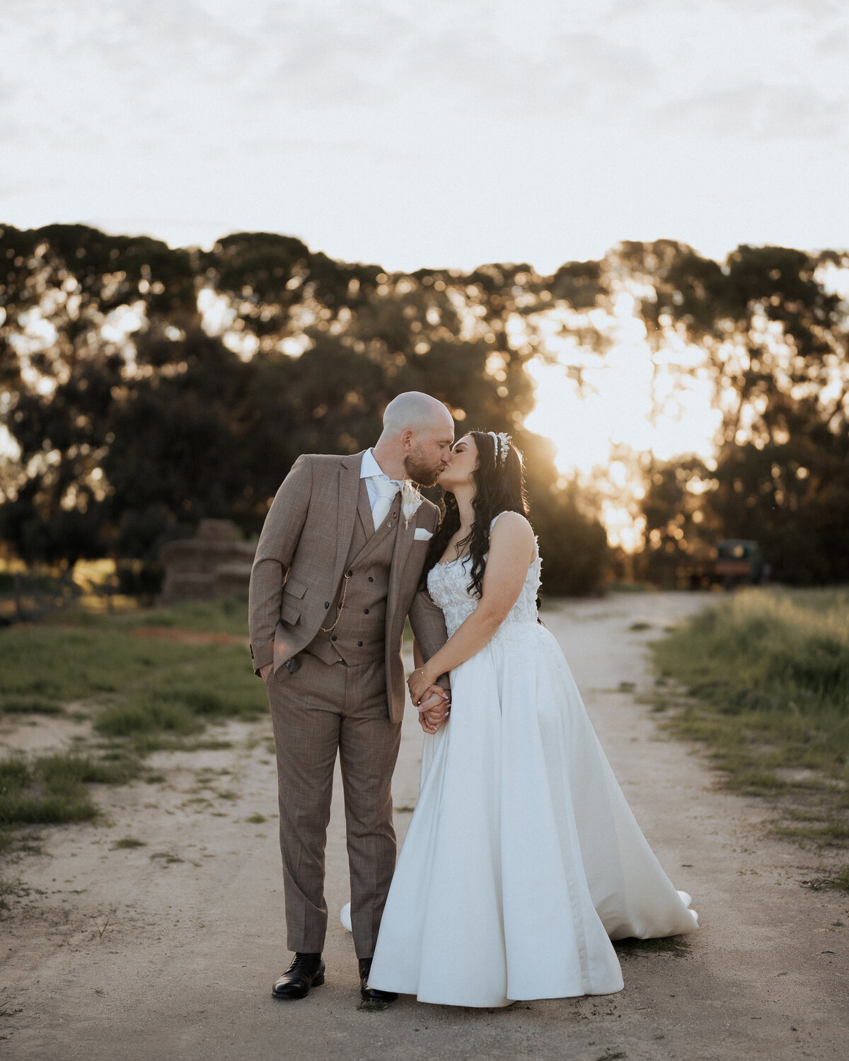 Bride and groom share a joyful laugh during their Adelaide wedding, captured beautifully by JakeyVass Media.