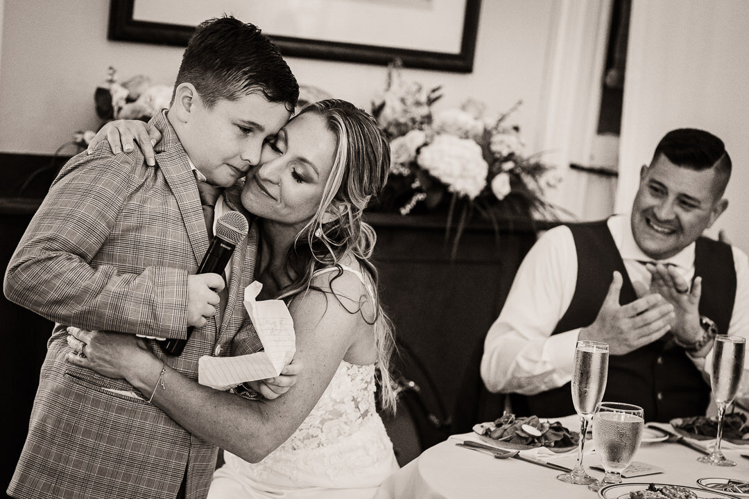 emotional-wedding-toast-mother-son-hug-nj-photographer