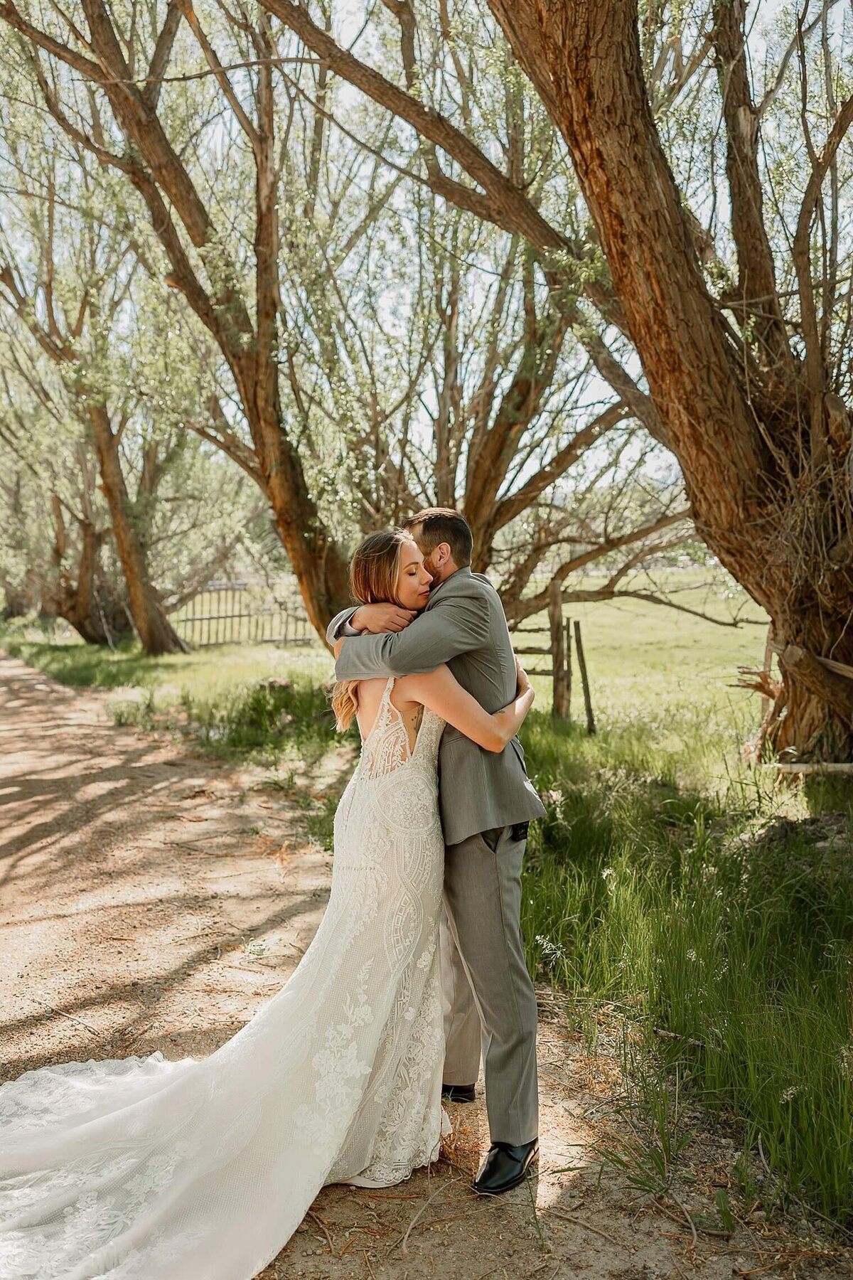 bride and groom couple portrait with them hugging. By Michelle Betz Photography Wedding Photographer