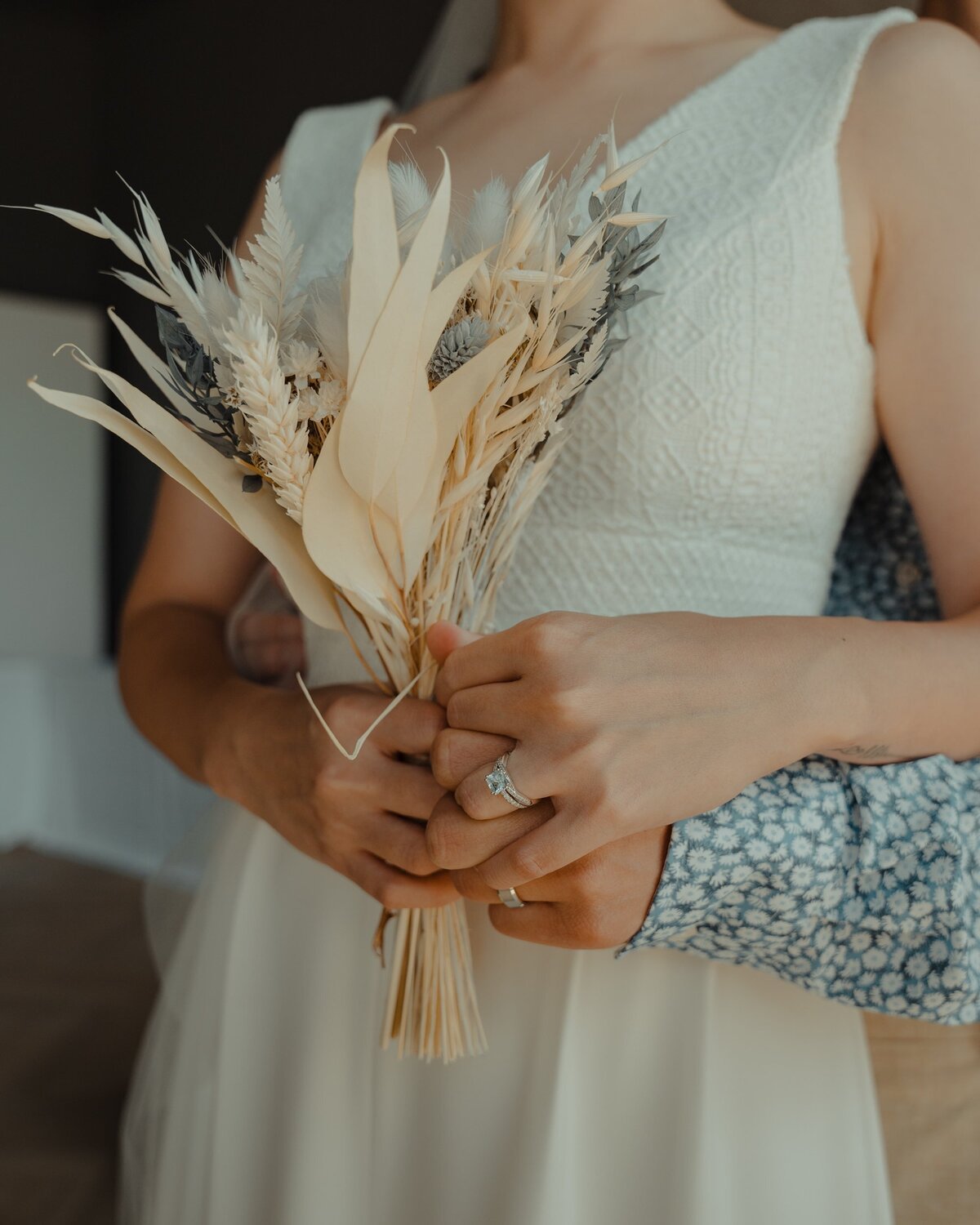 Bride holding organic beige bouquet