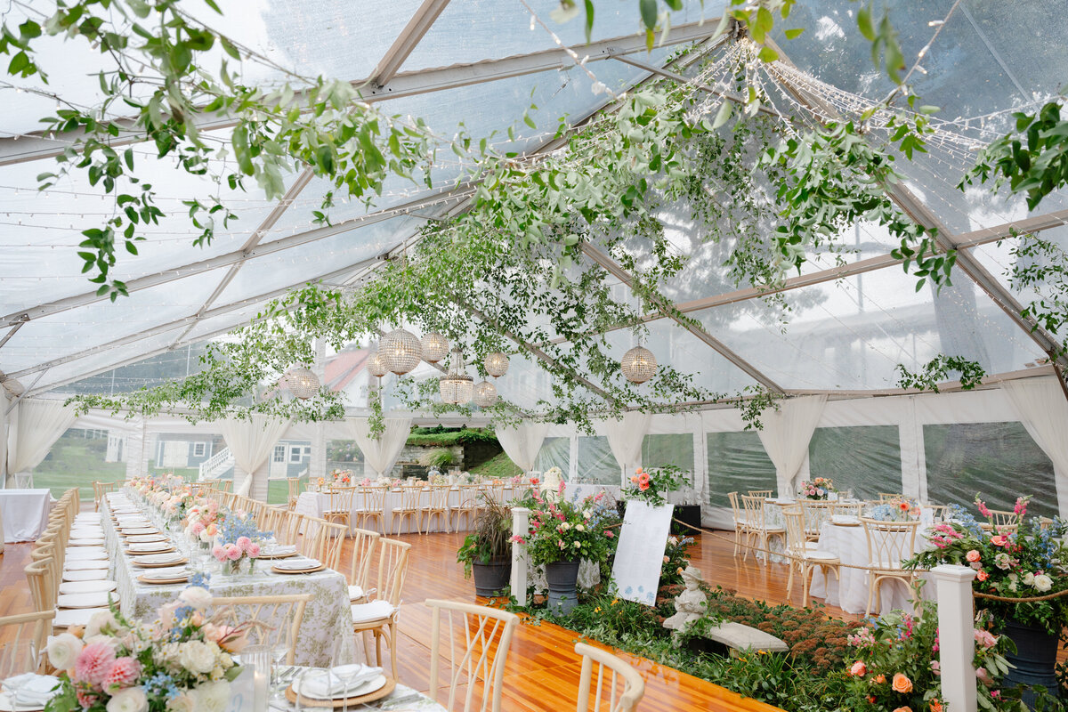 new-england-tent-wedding-greenery-on-ceiling-with-chandeliers