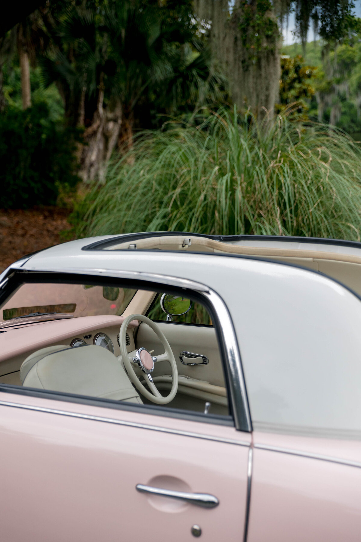 A convertible pink retro car