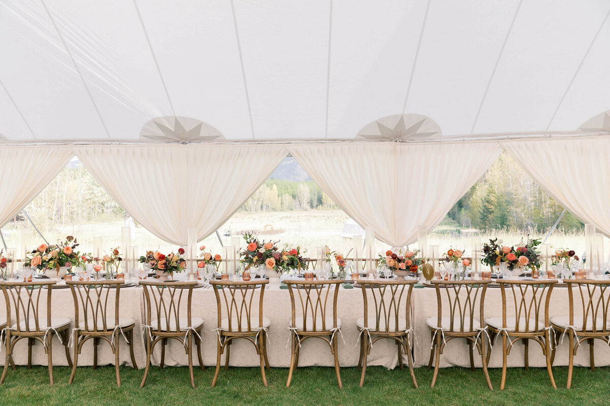 white wedding tent with tables and chairs