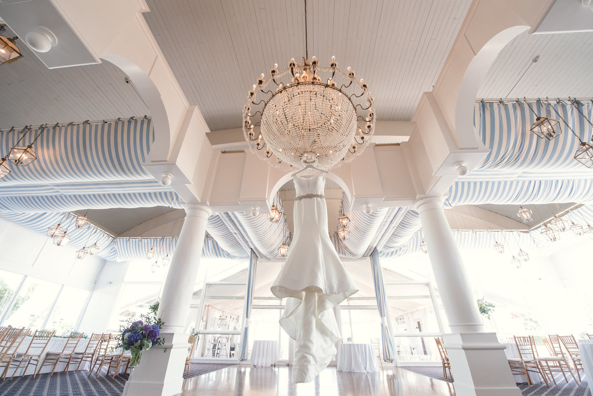 Wedding dress hanging in the ballroom of Oceanbleu