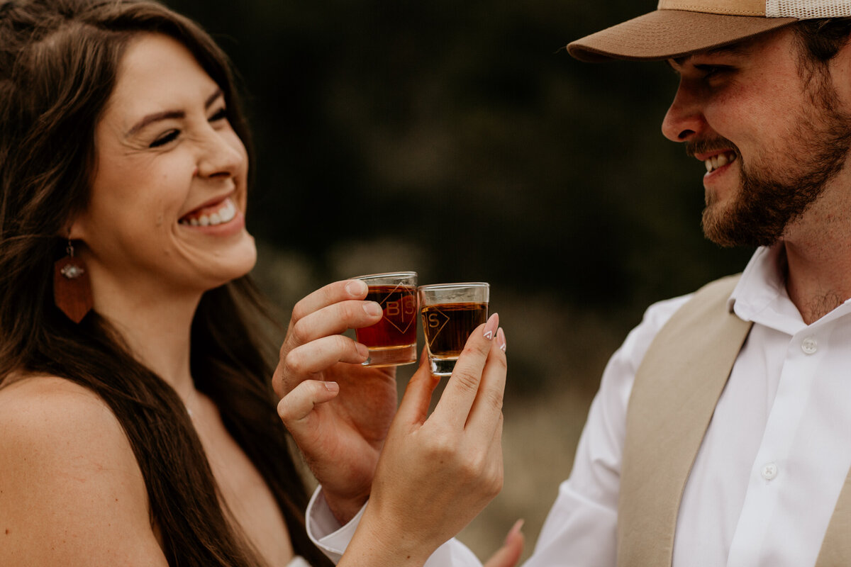 newlyweds about to take a shot of whiskey