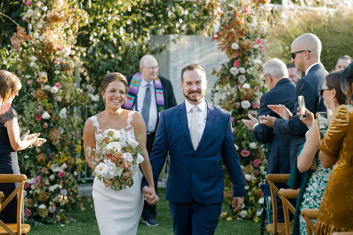 Fall bridal bouquet with lush autumnal colors of mauve, dusty pink, cream, white, peach, taupe, and green. Florals of dahlias, roses, clematis, lisianthus, and natural greenery. Fall wedding in Raleigh, NC. Design by Rosemary and Finch Floral Design in Nashville, TN.