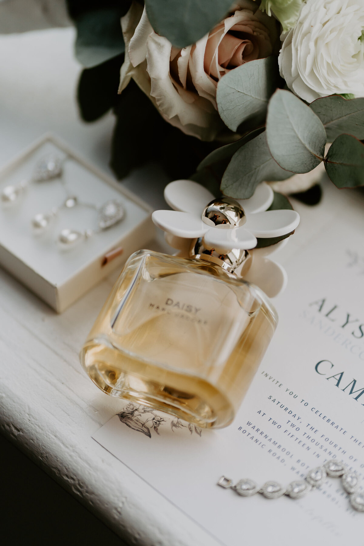 in loving memory table styled with candles and white rose bud vases at the Warrnambool Golf Club