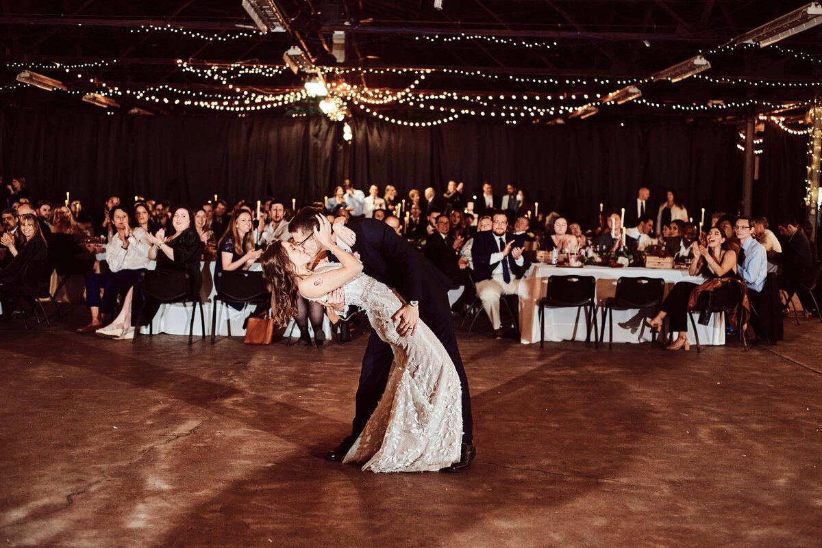married couple share first dance at Royal Oak Farmer's Market Royal Oak, Michigan Wedding_187