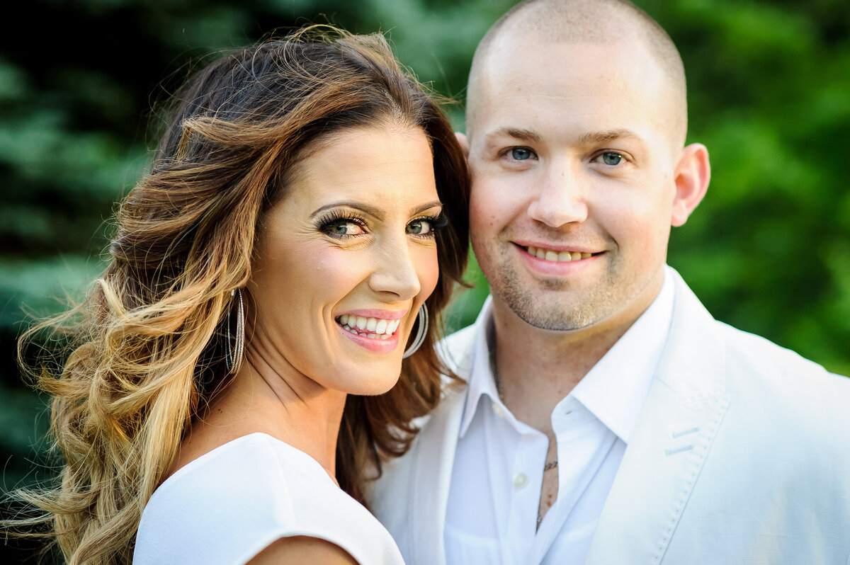 Closeup of a couple smiling at the camera