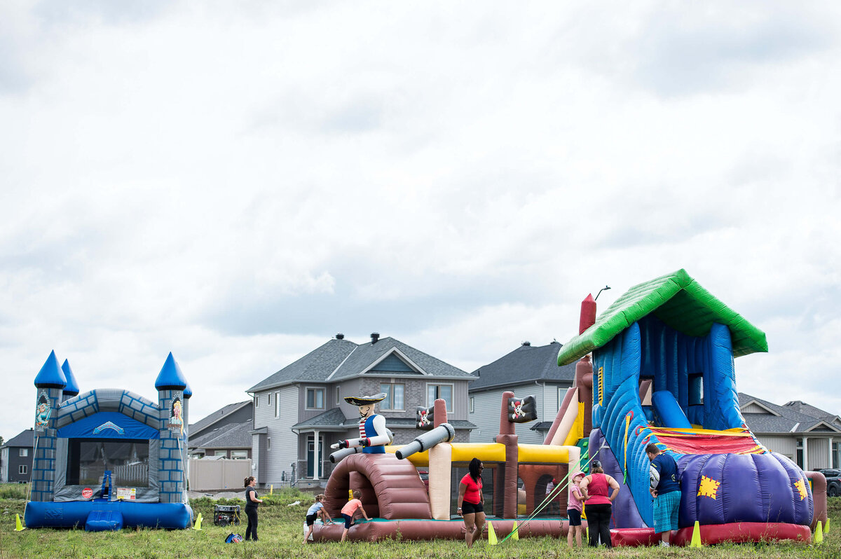 Ottawa event photography showing the bounce castles set up for a corporate children's event.  Captured by JEMMAN Photography COMMERCIAL