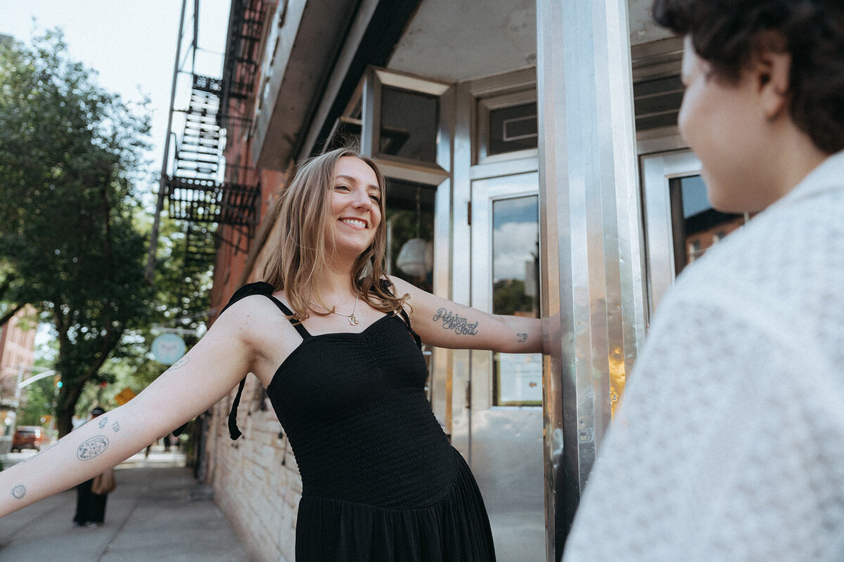 couple looking at each other during NYC engagement photos, captured by Elsie Goodman, an NYC engagement and couples photographer