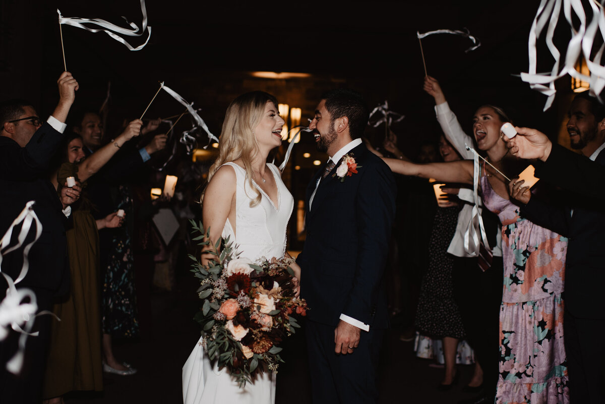 Photographers Jackson Hole capture bride and groom leaving reception