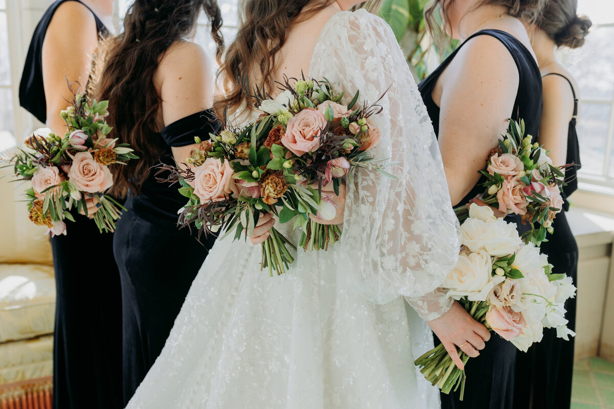 CLose up detail photo of bride and bridesmaids holding their bouquets