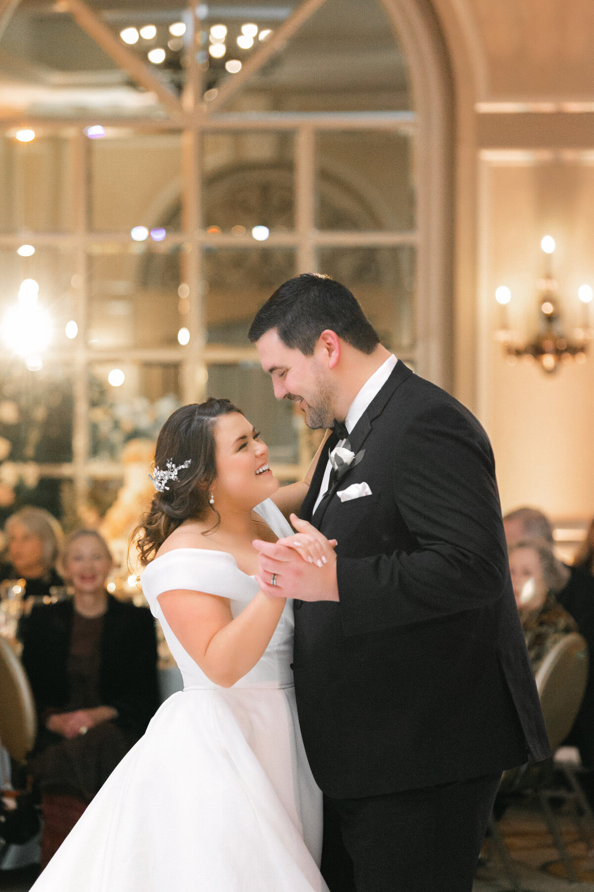 close up of bride and groom sharing their first dance at The Adolphus in Dallas, capturing a romantic and elegant wedding moment on the dance floor.