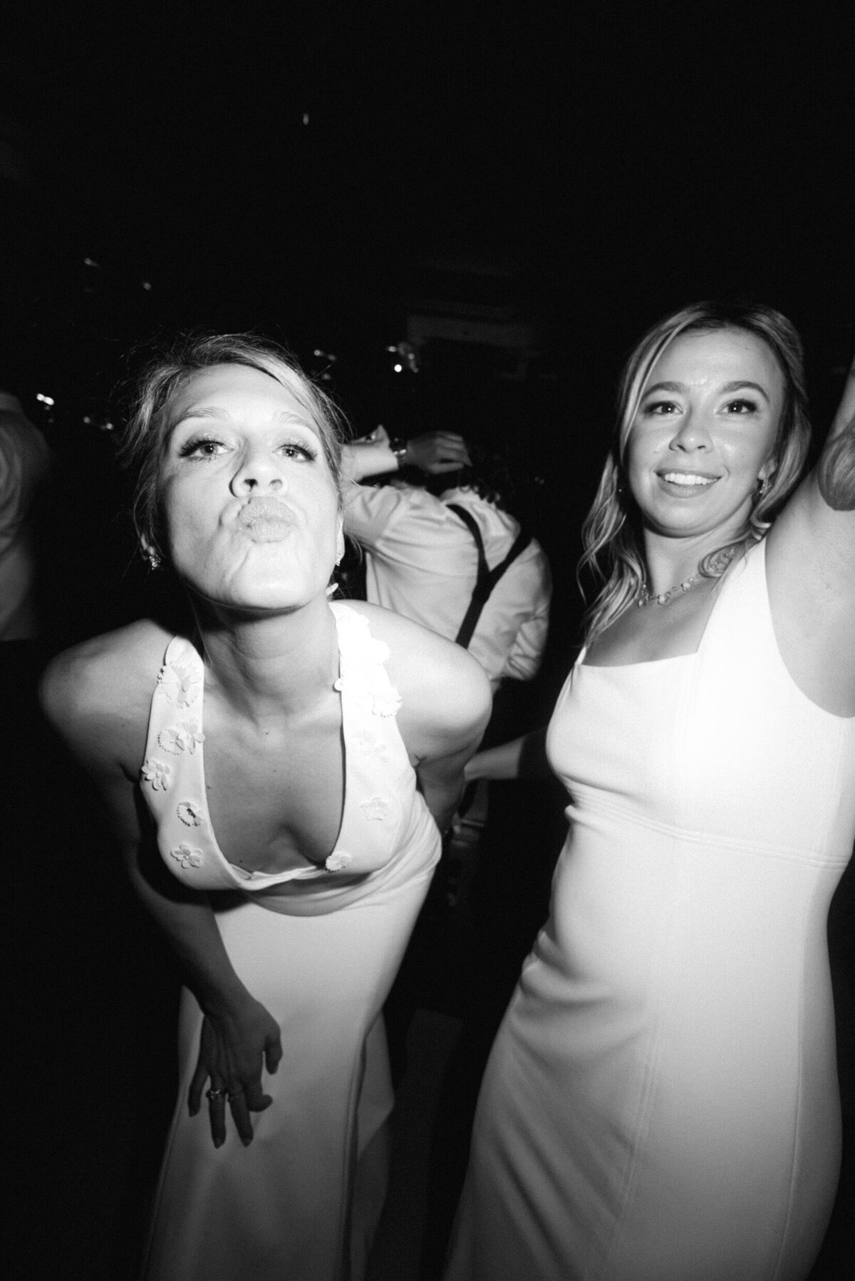 A black and white photo of the bride during her wedding reception