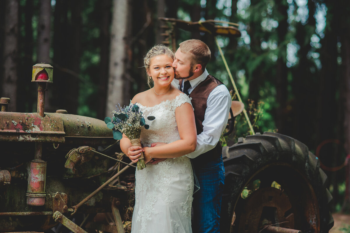 bride and groom with tractor