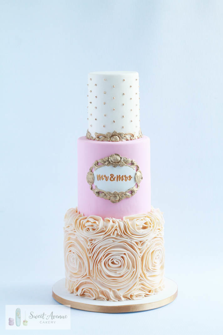 elegant ivory gold and blush wedding cake with ruffle rossettes and gilded trims, Hamilton ON wedding cakes