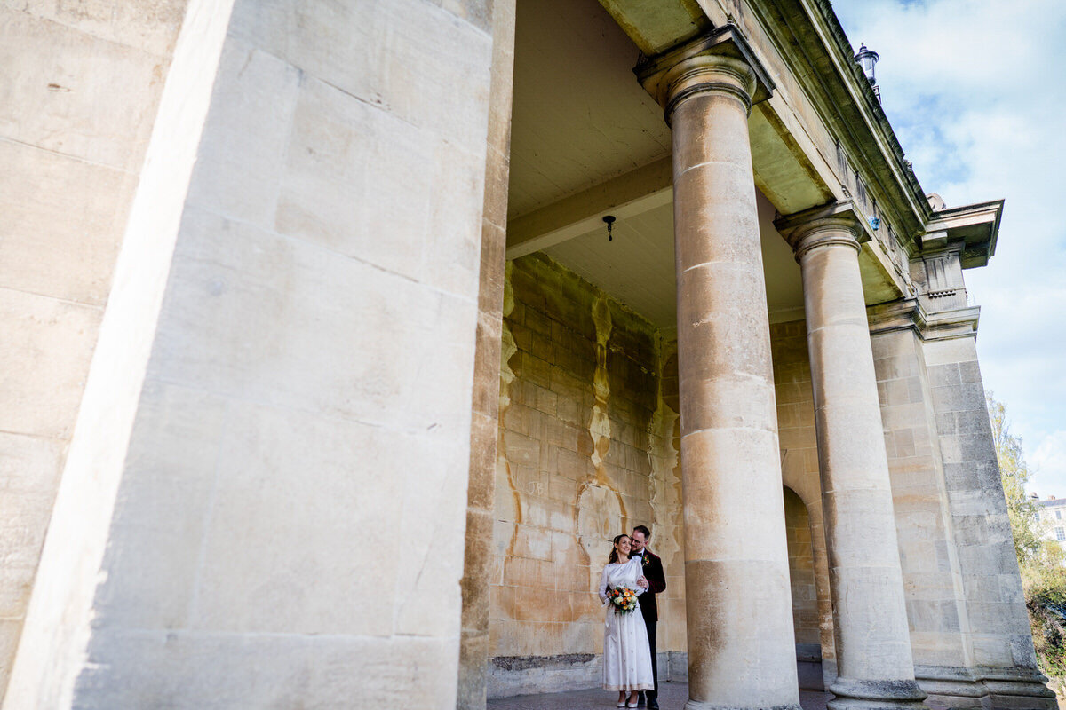 A couple having a photoshoot on their wedding day at parade gardens in bath. 